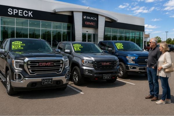 couple looking at used trucks